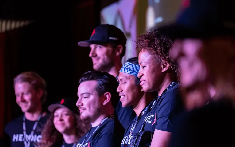 Certified Heroic coaches together on stage