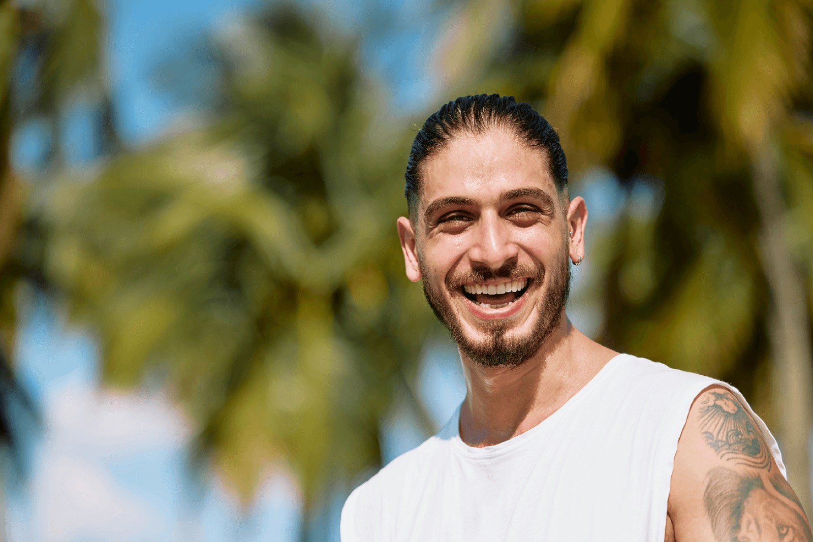 A Heroic member smiling outdoors in warm natural light